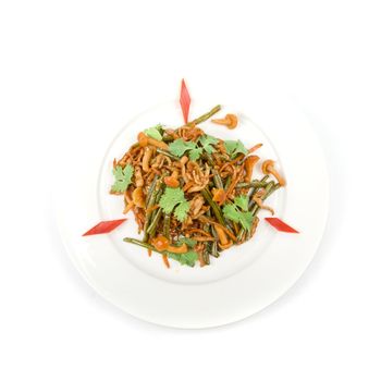 Tasty salad of mushrooms and vegetable dish close up on a white background