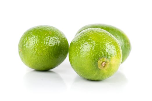 ripe brazilian limes isolated on a white background