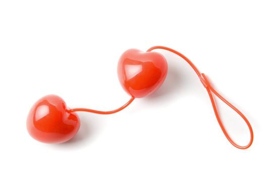 Red vaginal balls as heart for women isolated on a white