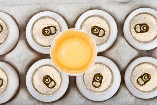 Eggs as aluminum can at the box isolated on a white background
