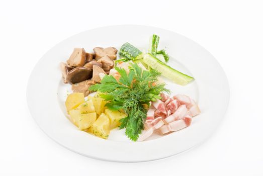 Tasty snacks: potato, fat and vegetables at plate isolated on a white