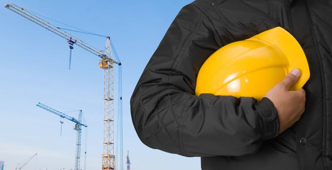 building panorama with builder closeup