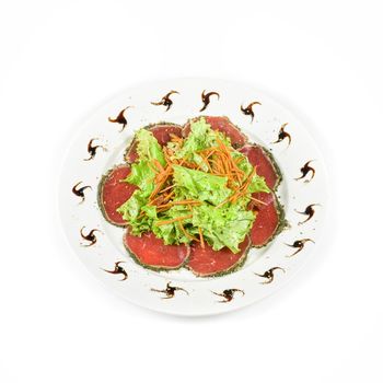 red beef sliced meat with greens isolated on a white background