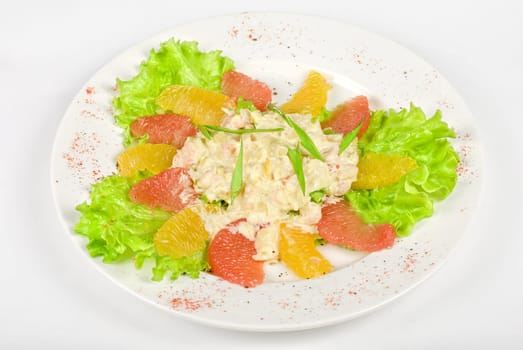 seafood salad of shrimp baked at cream with orange and grapefruit isolated on a white background