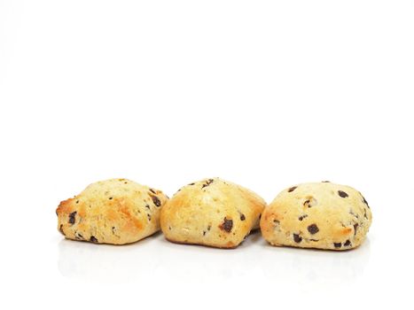 three spongy chocolate chip scones on white background