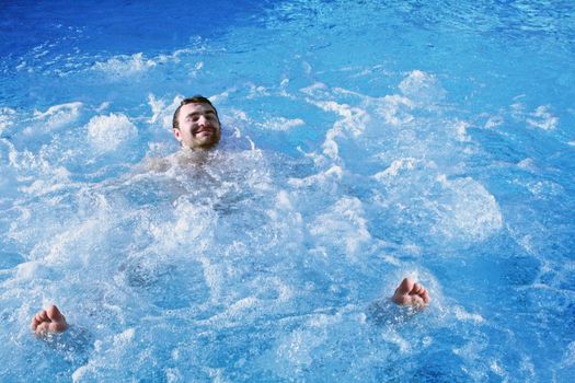 young attractive man relax in spa area