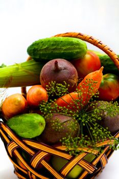 An image of fresh vegetables in wooden backet
