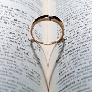 An image of a golden ring with shade in the form of heart