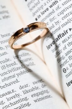 An image of a golden ring with shade in the form of heart