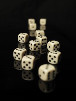 Rolled dices on black background