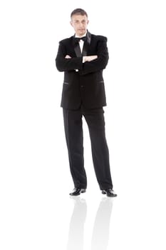 The elegant man in a classical tuxedo on a white background