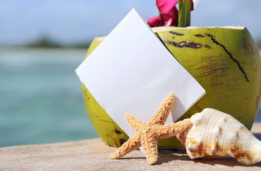 Coconut cocktail starfish tropical Caribbean beach refreshment and towel