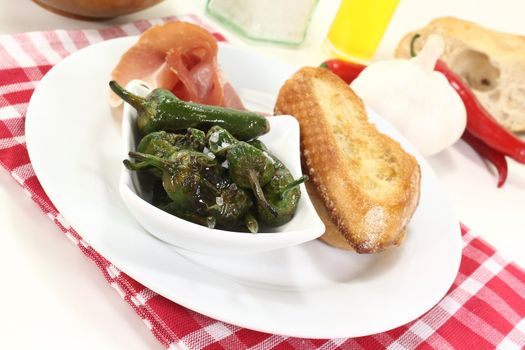 Pimientos with sea salt, Serrano ham and sauteed baguette