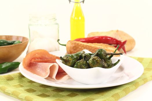 Pimientos with salt, Serrano ham and sauteed baguette