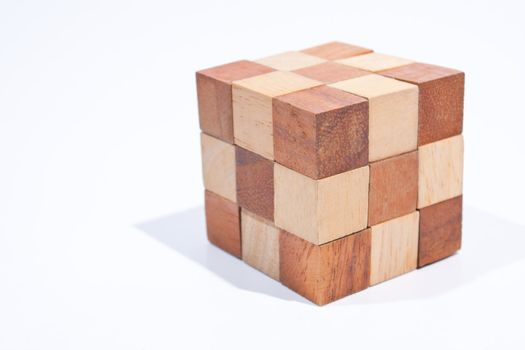 Wooden toy cube. Placed on a white background, then shoot.