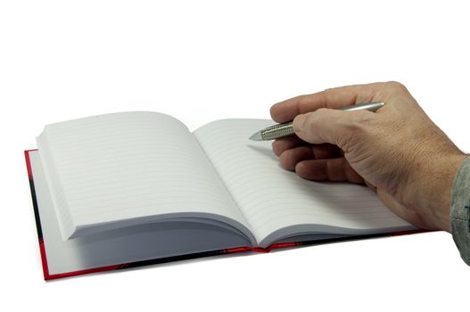 male hand writing in empty book