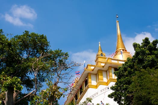 Golden Mountain attractions. Temples in Bangkok on bright
