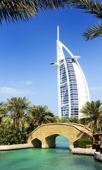 View at hotel Burj al Arab from Madinat Jumeirah in Dubai. Madinat Jumeirah encompasses two hotels and clusters of 29 traditional Arabic houses. United Arabe Emirates