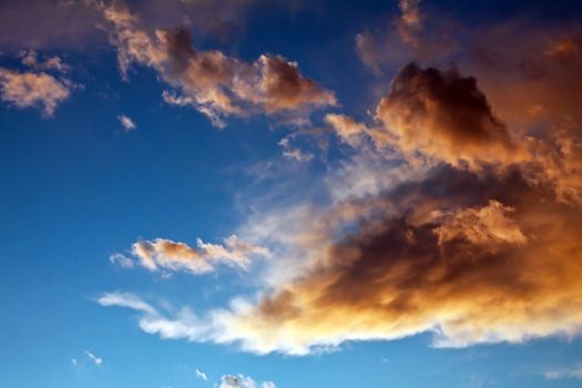 some stormy clouds entered in bright sky