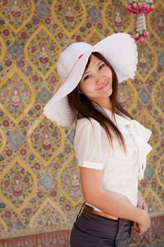 smiling young thai girl on the thai paint background