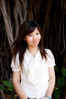 smiling young thai girl and white hat in travel.