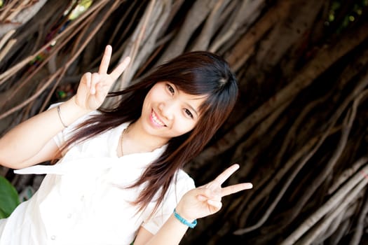 smiling young thai girl and white hat in travel.