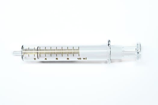 Glass Syringe in white background.
