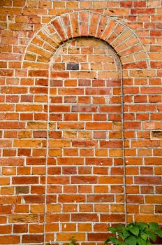 Background of ancient red brick wall arch imitation. Architectural backdrop details.