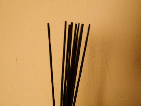 incense sticks on a yellow background