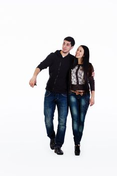 Young lovers walk their talk, they have fun. Shot in studio over white background.