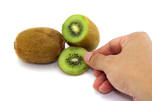 Sweet kiwi holed by hand on the white background.