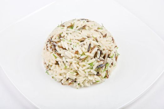 Rice with vegetable on a plate closeup