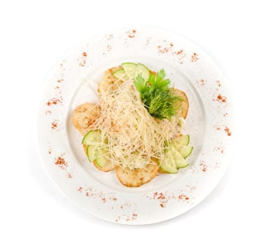 Salad dish with dried crust, vegetables, greens and cheese