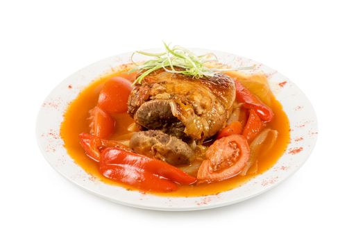 knuckle of veal with vegetables isolated on a white