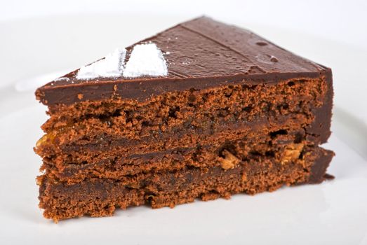 Tasty chocolate cake on a plate closeup