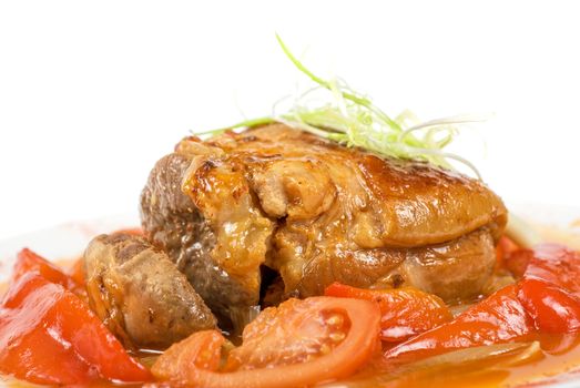 knuckle of veal baked with vegetables closeup