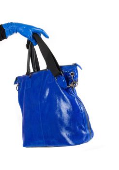 Blue women bag at hand isolated on white background