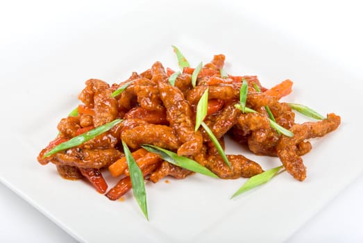 Roasted Beef at sour-sweet sauce on a white background