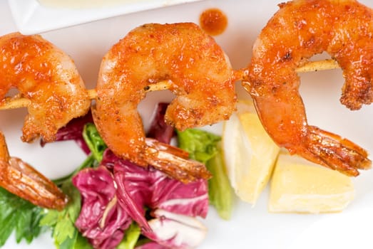 Fried kebab of shrimps with vegetables and sauce