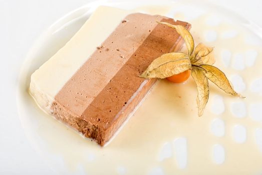 tiramisu dessert with ground-cherry closeup on a white