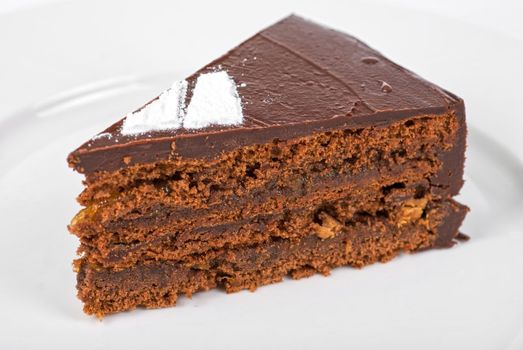 Tasty chocolate cake on a plate closeup
