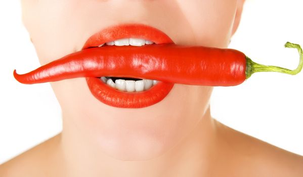 red chilli pepper at woman mouth on a white