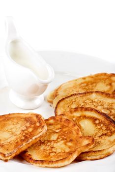 thick pancake with sauce on a white