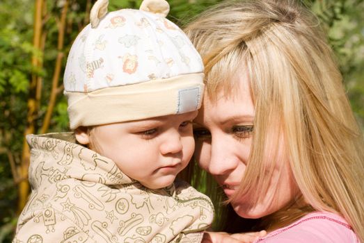 happy mum and her boy outdoor portrait