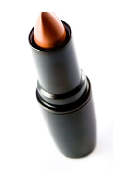 Stock photo: cosmetics: an image of a beige lipstick in black case