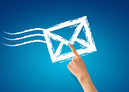 Hand pointing at a envelope on blue background.