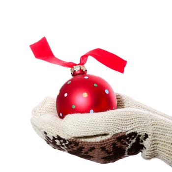 An image of red christmas ball in hands