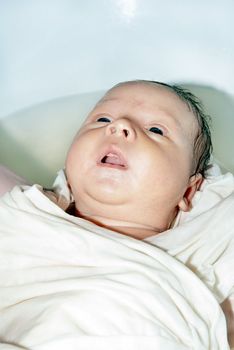 Cute newborn baby in the bath washable.