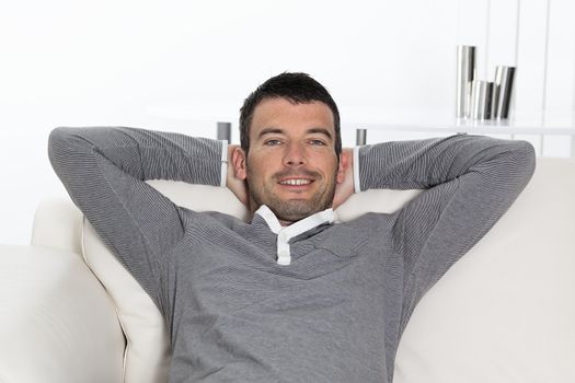 cool man sitting on sofa at home