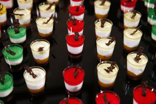 Colorful desserts and pastry served on a wedding party